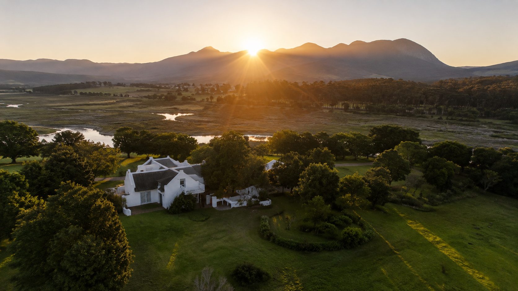 The stone entrance wall at Coppull, aloes and fynbos, Klein River mountains beyond