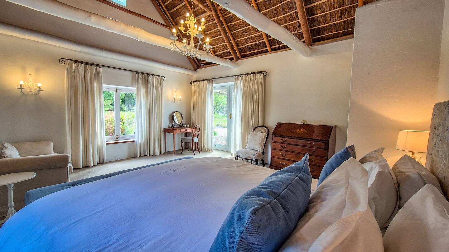 Main bedroom under thatch, doors to the garden